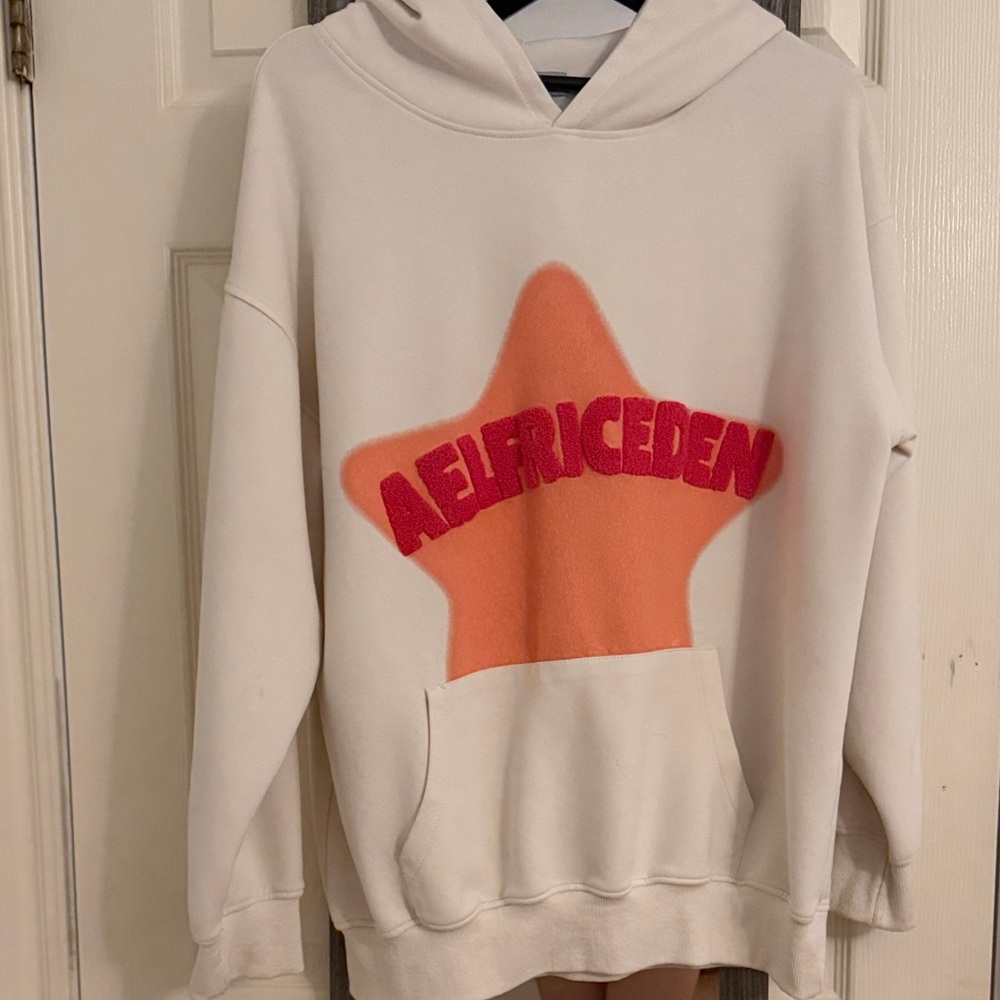 Cream Hoodie with Orange Star Design